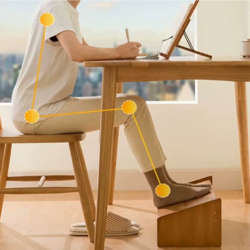 femme assise meilleure posture avec repose pied bureau