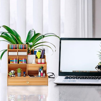 organiseur pour bureau en bois devant plante sur une table 