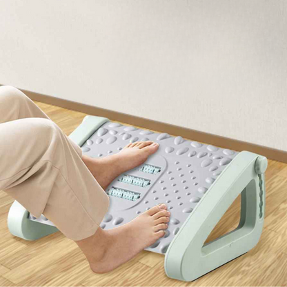 pieds de femme sur bureau repose pied gris et vert
