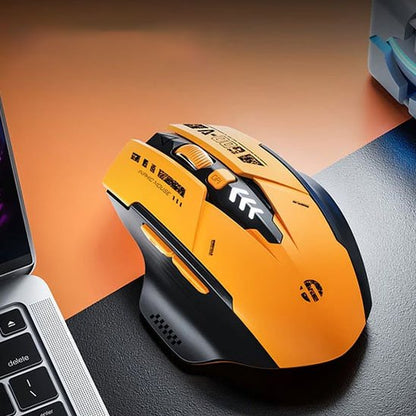 souris gaming sans fil orange sur bureau