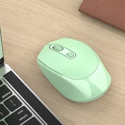 souris sans fil bluetooth coloris vert sur bureau beige