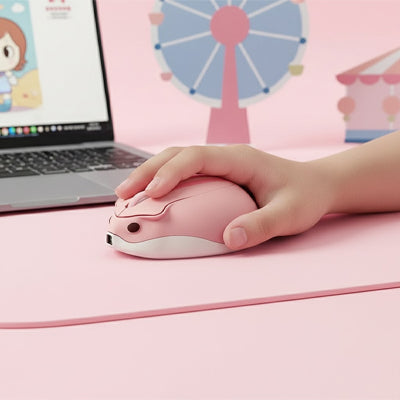 souris sans fil design forme hamster couleur rose devant ordinateur