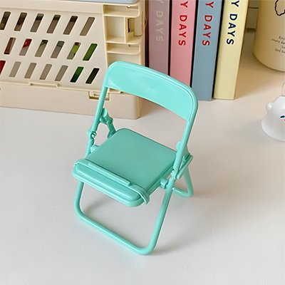 Support téléphone sur bureau devant livres